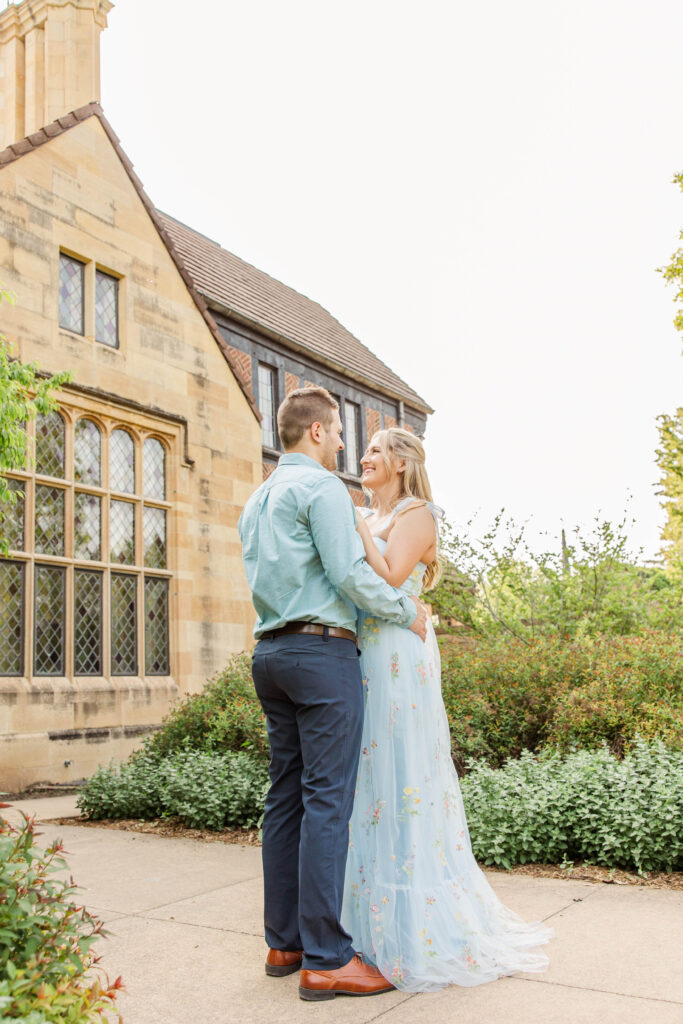 Engaged couple in front of the Paine Art Center in Oshkosh, Wisconsin. 