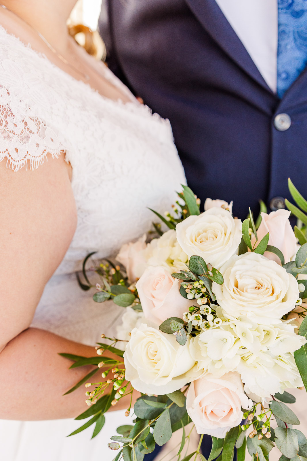 Bride and groom with bouquet