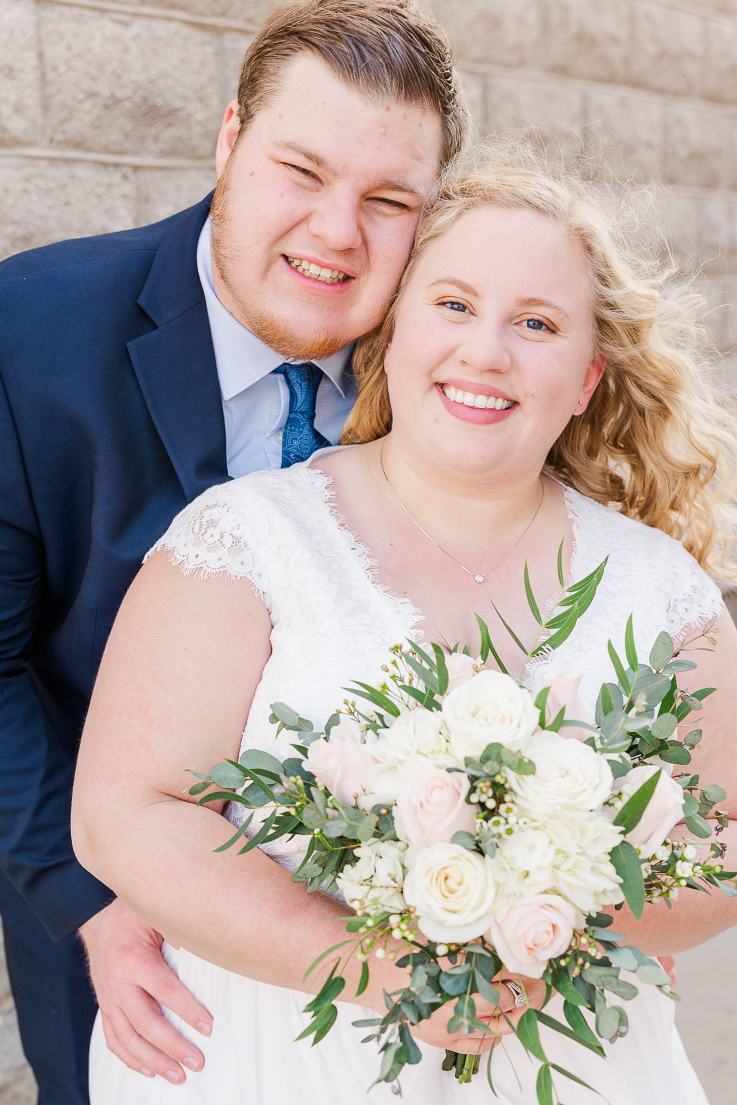 Bride and groom portrait smiling at camera