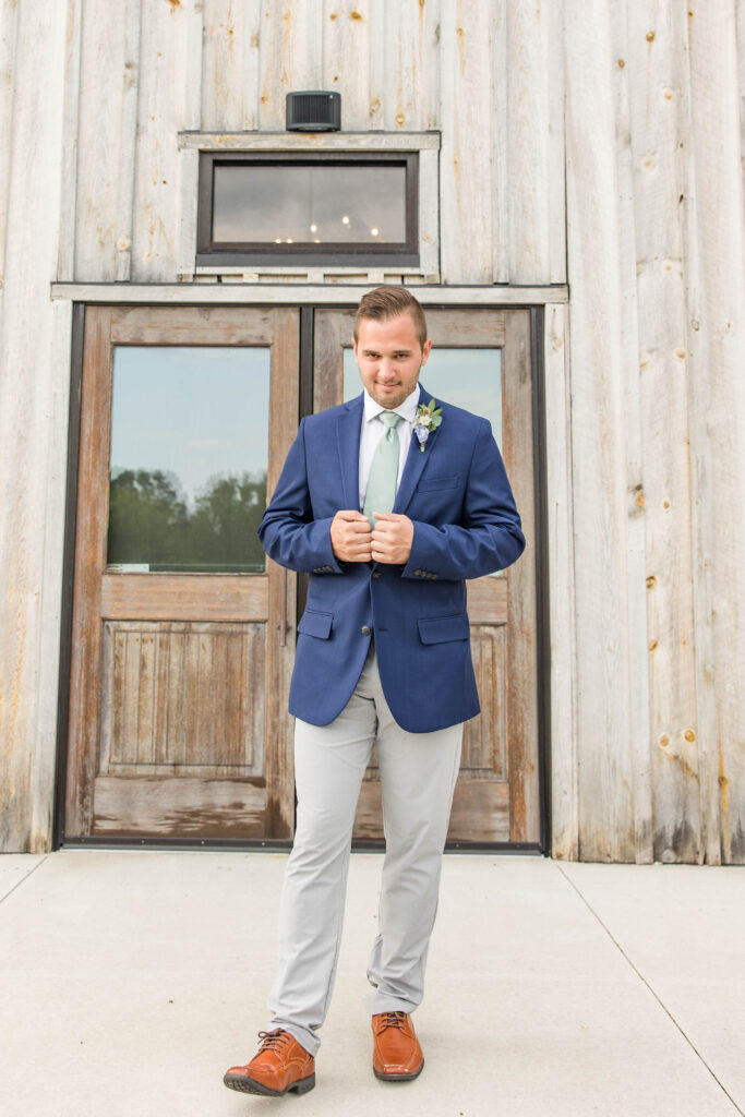 Groom getting ready on wedding day. 