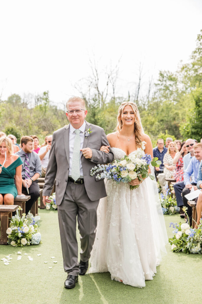 Father of the bride walking bride down the aisle. 