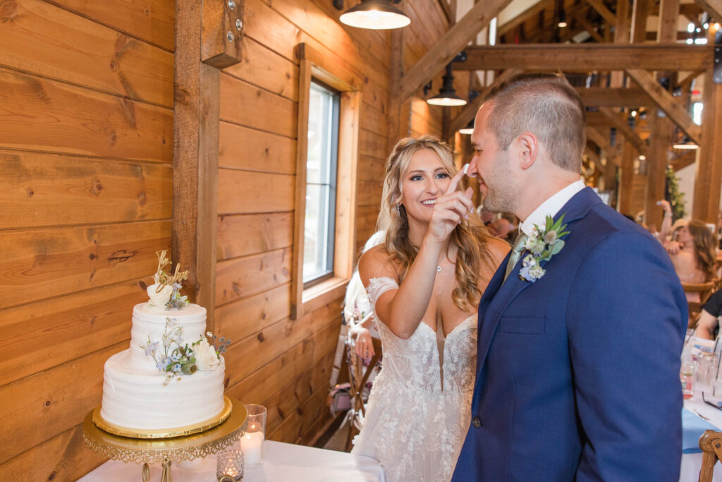 Bride and groom cutting their wedding cake. 