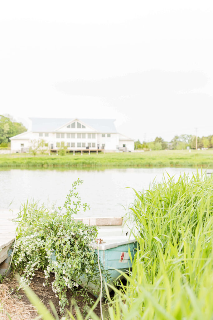 Blue paddle boat with greenery in front of Fete of Wales wedding venue in Waukesha, Wisconsin. 