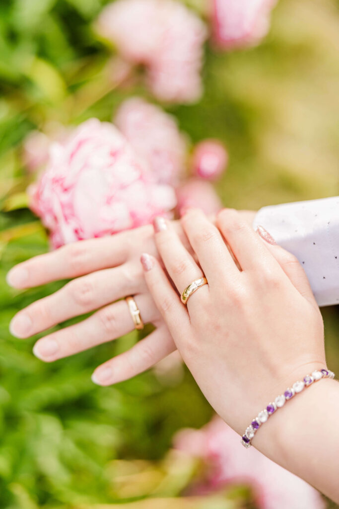 Detail shot of wedding rings at couple's anniversary photoshoot.