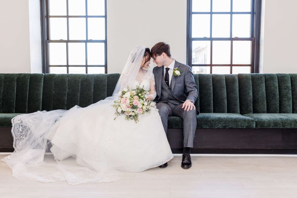 Bride and groom resting foreheads on wedding day at 10 South in Madison, Wisconsin.