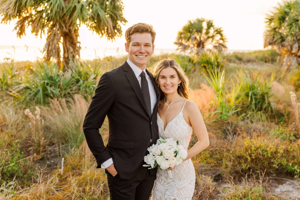 Bride and groom looking at the camera destination wedding in Florida.