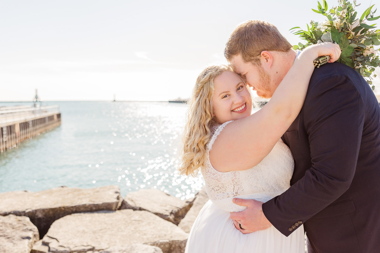 Bride and groom in front of Lake Michigan