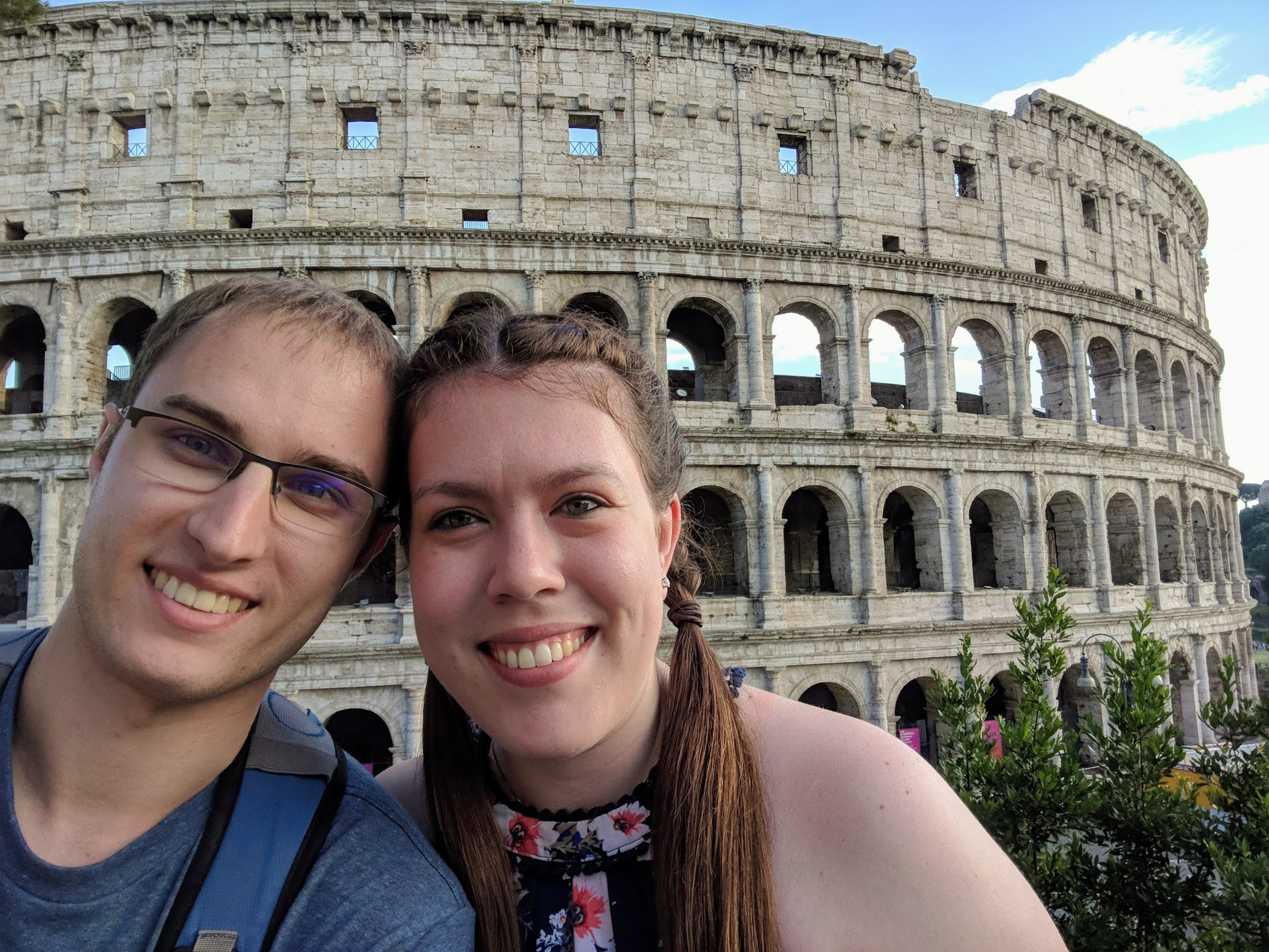 Couple in front of Colosseum in Rome, Italy