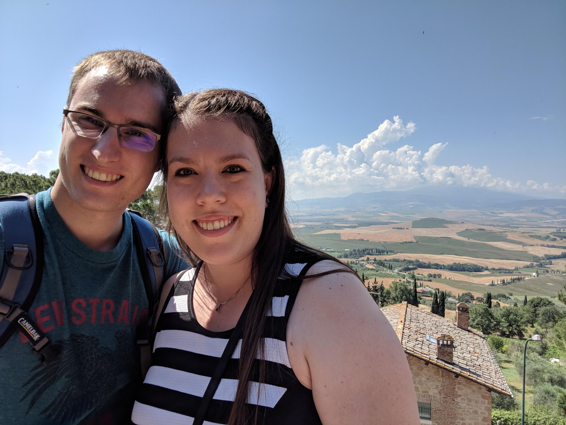 Couple in front of views of Tuscany, Italy