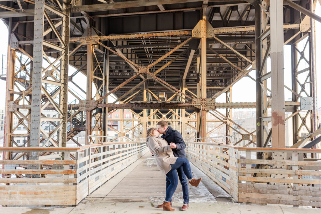 Dip kiss under a bridge in Milwaukee, Wisconsin. 