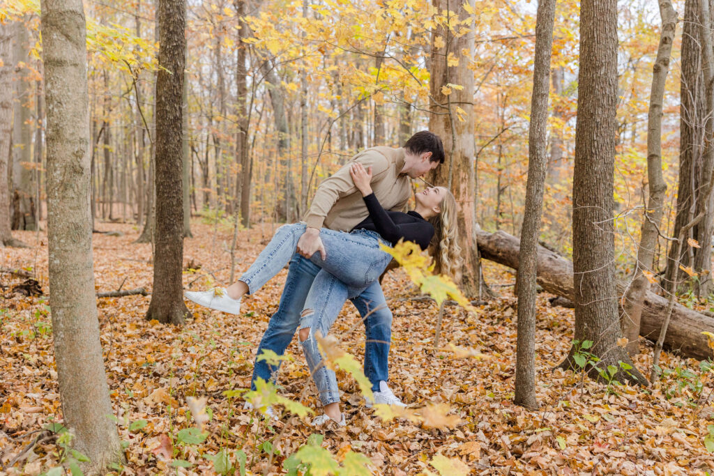 Dip Kiss in yellow Fall Leaves engagement session Milwaukee, Wisconsin. 